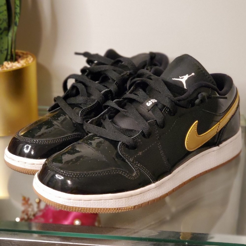 Nike Jordans black and gold lowtops